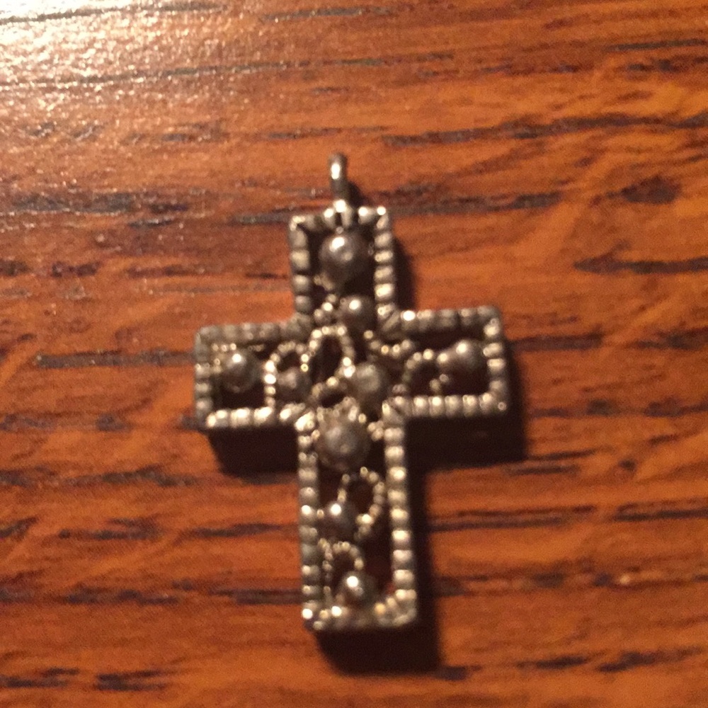 Intricate grey and black cross